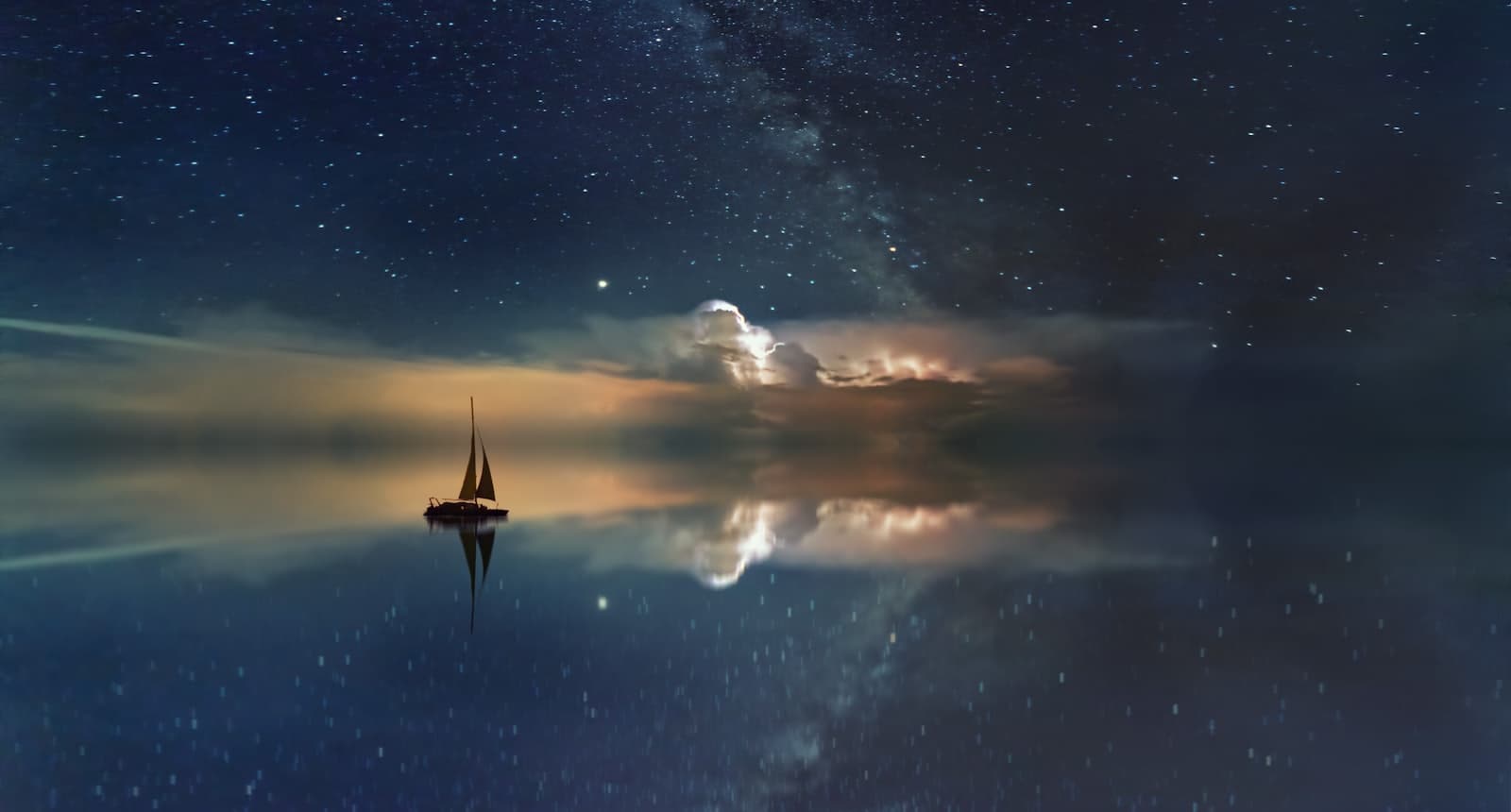 A lone sailing ship on a vast, mirror-still sea beneath a sky of stars.