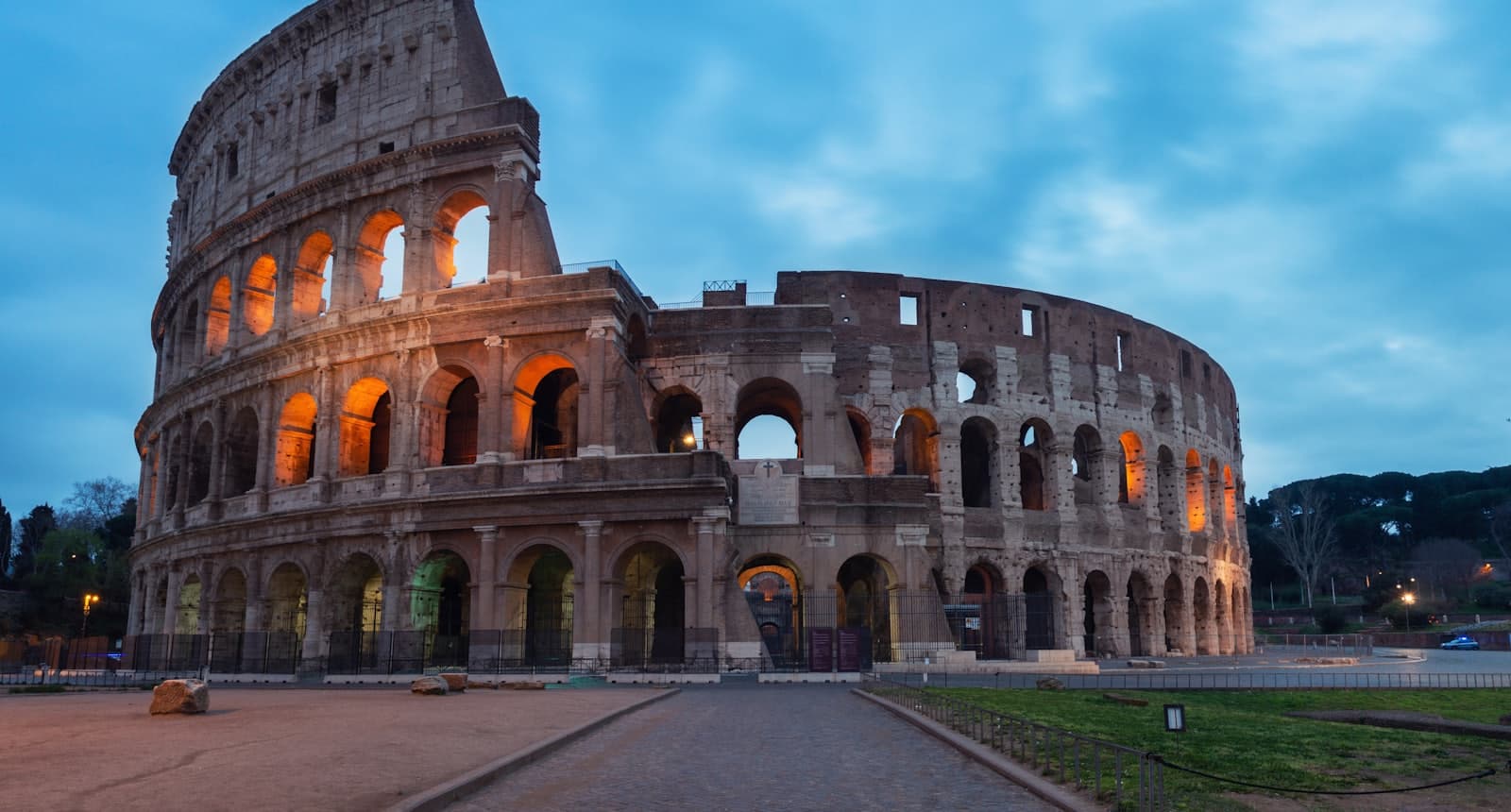 The ruins of a great imperial city, its arches broken and silent at dusk.